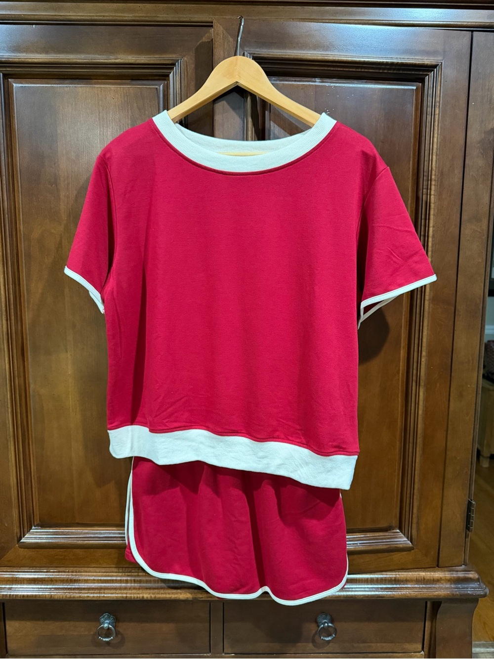 Women’s Red Short Sleeve Top with White Trim and matching skort.